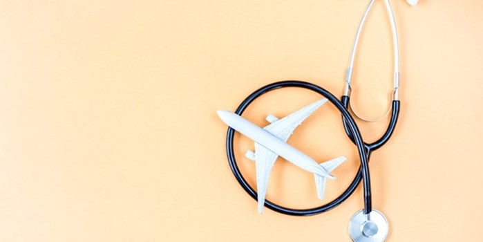 A model plane next to a medical stethoscope