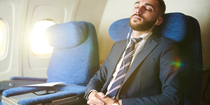 a passenger listening to calming music during a flight.