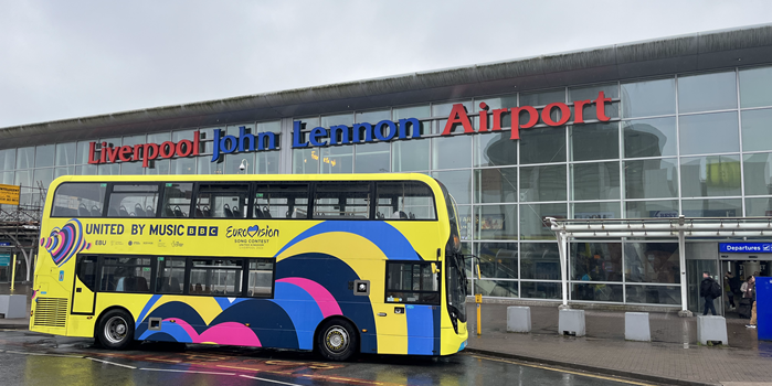 Eurovision-branded bus outside Liverpool John Lennon Airport